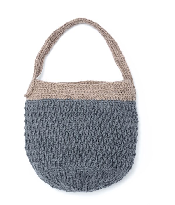 Vrijstaande foto van de duurzame en stoere tas. De tas is blauw met een grijze rand bovenaan en een grijs handvat.